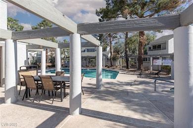 View of swimming pool featuring a patio area and o