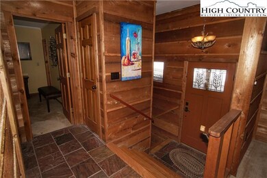 Wood foyer with slate flooring