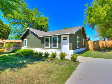 Ranch-style home featuring a front lawn