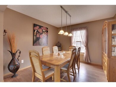Formal dining room with pergo style flooring and g