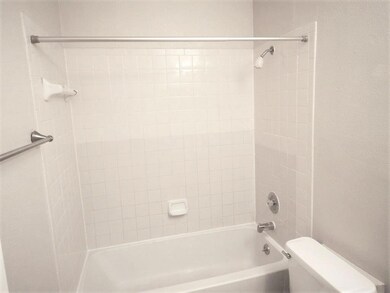 Full bathroom with tub / shower combination and t