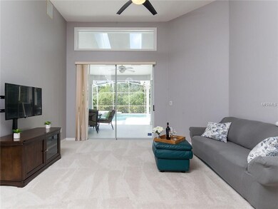 Living area has a view of the pool.  Transom light
