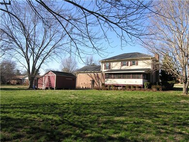 Large screen porch across rear of home.