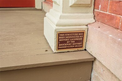 Plaque on the pillar of the front entry is proof t