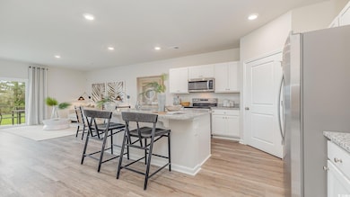 Kitchen with a breakfast bar area, an island with 