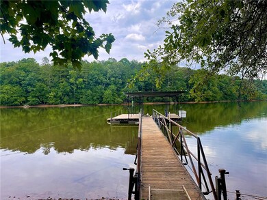 covered dock with beautiful lake views