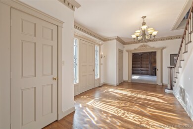 Front entryway and office/library/media/study.  No