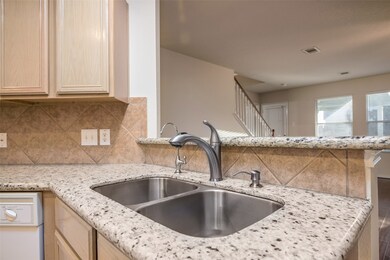 Updates include faucet, sink and granite counters.