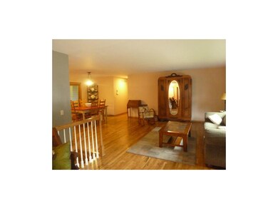 Large, living area with beautiful hardwood floors