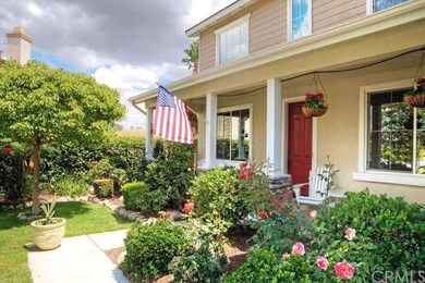 Inviting manicured landscaping with lovely roses.
