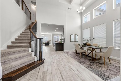 Entrance foyer featuring a chandelier, wood finis