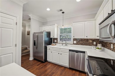 Large kitchen with lots of cabinets, pantry and stainless steel appliances remain with home