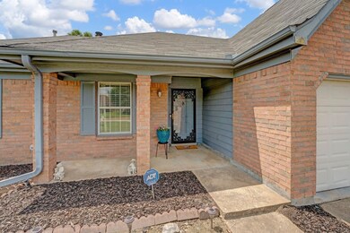 Doorway to property featuring roof with shingles a