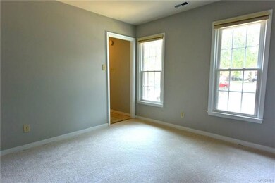 Living room/office with new carpet and fresh paint