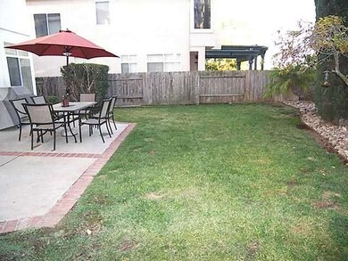Enjoy outdoor dining on the backyard patio.