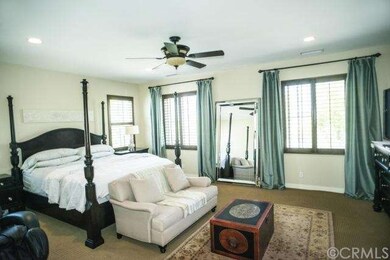 Master bedroom with plenty of light and ceiling fa