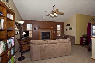 Open floor plan starts with living area with firep