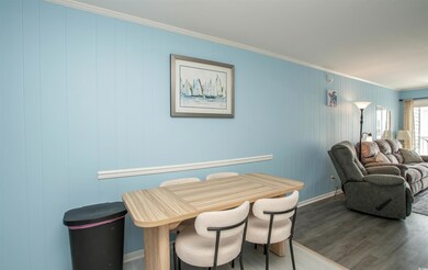 Dining room with wood finished floors, ornamental 
