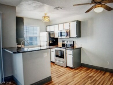 Kitchen with appliances with stainless steel finis