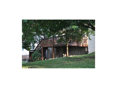 Deck with stairs down to covered patio.