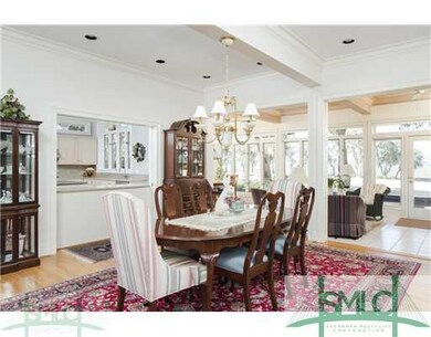 Dining Area with a view into the kitchen and sunro