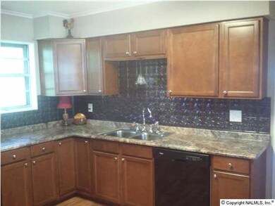 View of Kitchen. New cabinets, new countertops, great back splash.