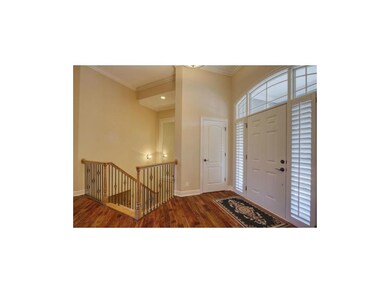 A GRAND ENTRY AWAITS YOU WITH MAIN LEVEL HARDWOODS