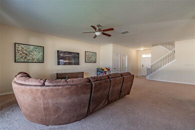 Family room looking towards front door and stairca