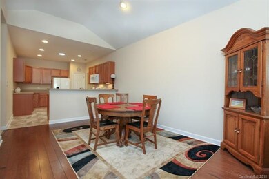 Spacious dining area is open to the kitchen