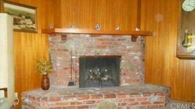 Beautiful brick fireplace with raised hearth
