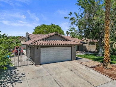 Mediterranean / spanish home with a tile roof, dri