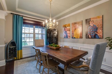 Note the extensive trim in the trey ceiling as well as the picture framing in the walls.