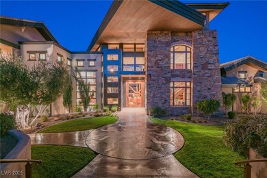 Modern home with a front yard, stone siding, and s