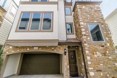 The 2 car attached garage with small porte-cochere