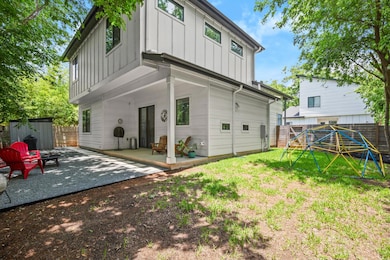 Back of property featuring board and batten sidin