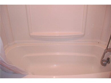 Other. Newer tub surround in the front unit bathro