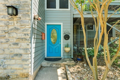 View of exterior entry with stone siding