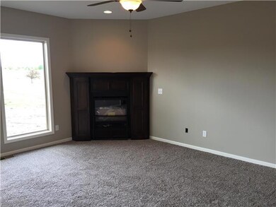 Living Room With Corner Fireplace!