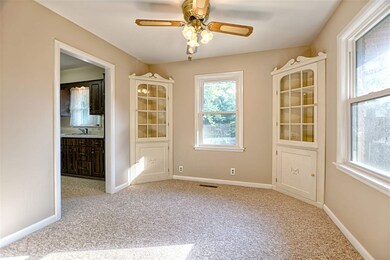 The dining room features built in china cabinets. 