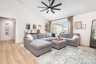 Living area with high vaulted ceiling, wood finish