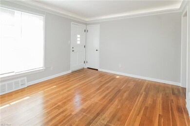 View of hardwood floored spare room