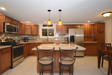 Great island w/ pendant lighting, built-in pantry