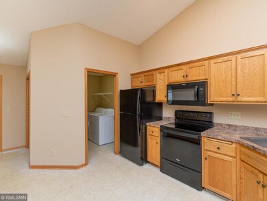Kitchen area with spacious laundry area/storage