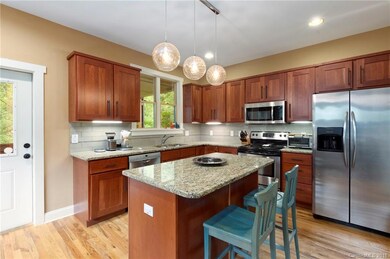 Open Kitchen with Granite Countertops and Stainless Appliances