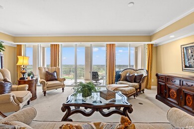 Living room with light carpet and crown molding