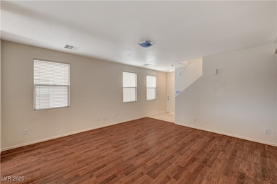 Spare room with wood finished floors and baseboard