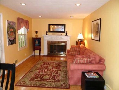 Family Room. The Family room features a Wood burni