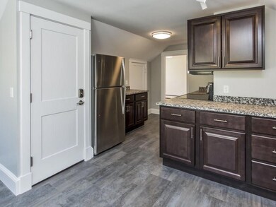 Plenty of cabinets for storage in...