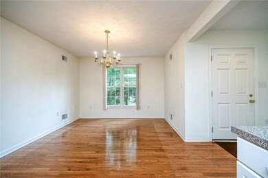 HARDWOOD FLOORS ACCENT THE DININGROOM.