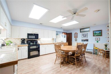 Spacious kitchen with plenty of cabinets, stone co